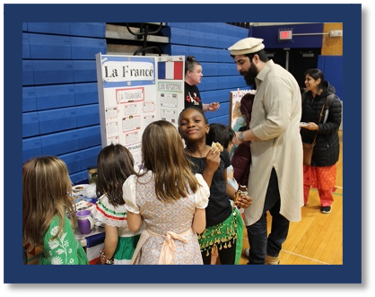 A person standing next to a group of children